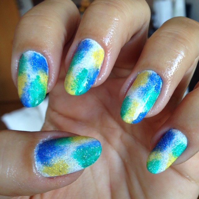 Green, yellow, blue and white "tie-dye" effect nails - somanylovelythings