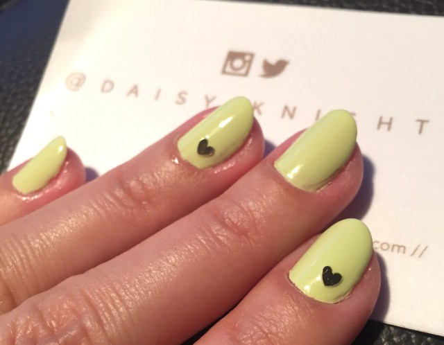 yellow nails with gold heart sticker