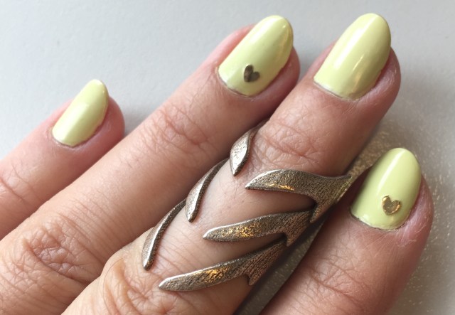 yellow nails with gold heart sticker